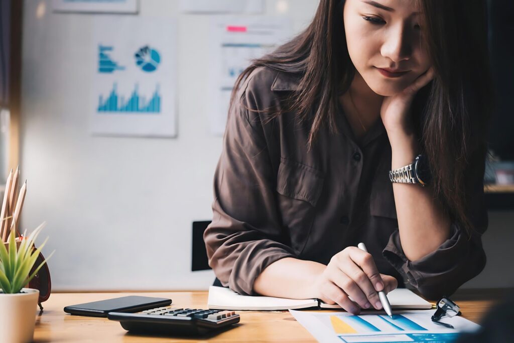 Business women calculating analytics