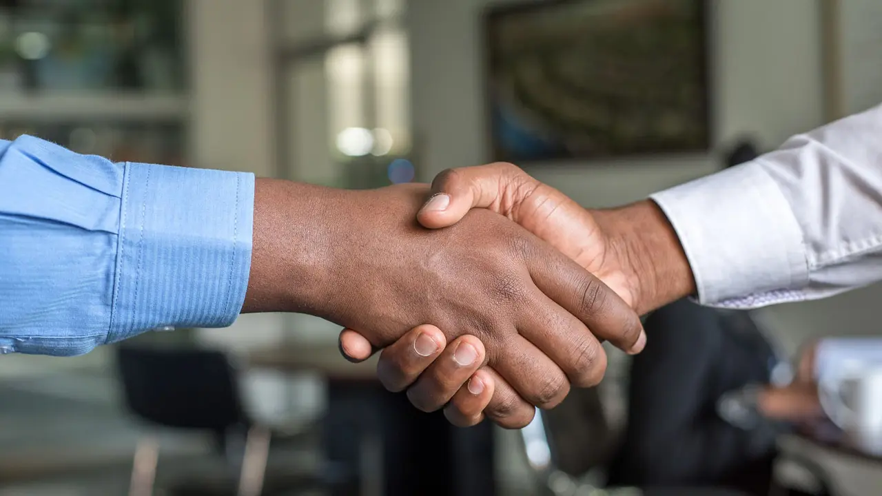 Close up of people shaking hands