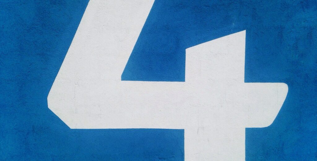 A white number four on a blue background