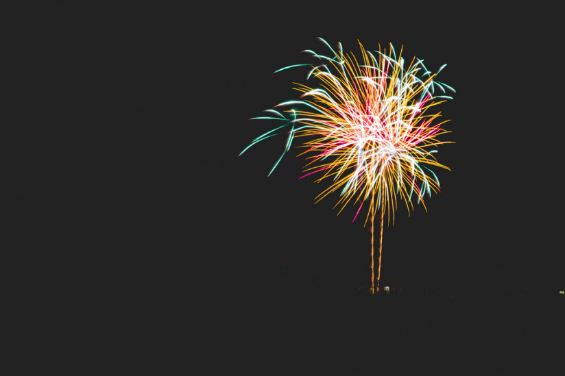 Firework exploding in a dark night sky