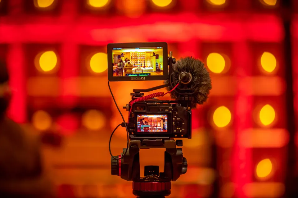 Small film camera recording a dinner scene