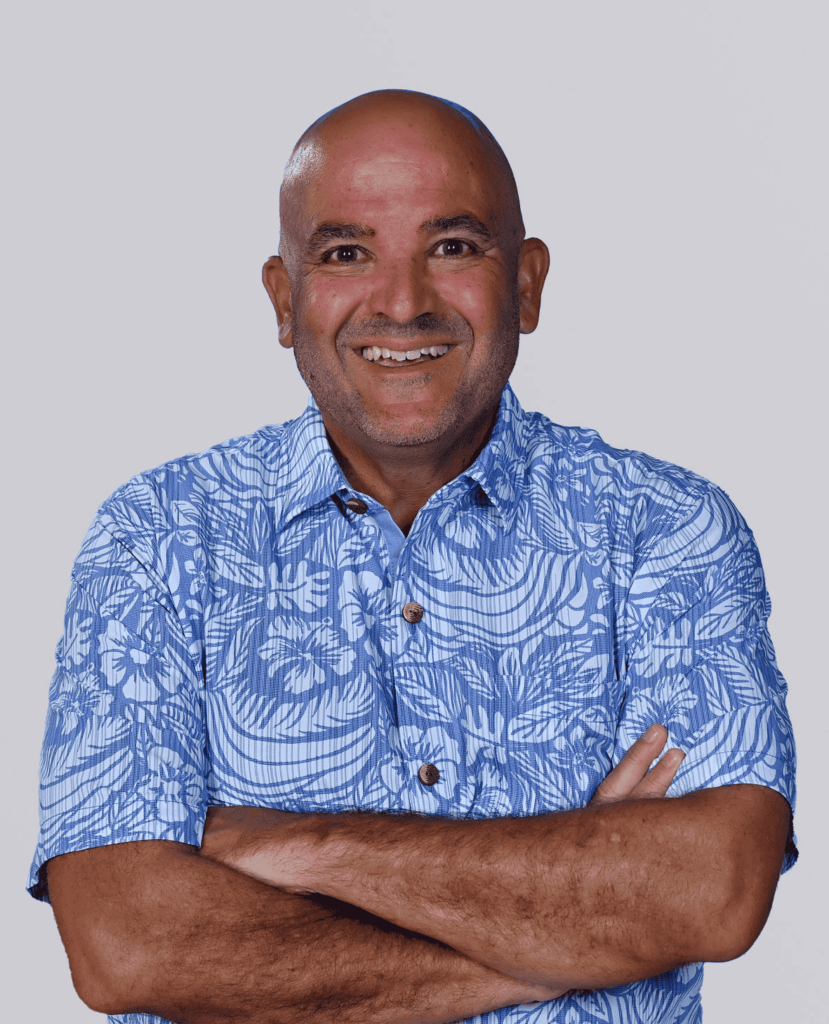 Professional Headshot of a smiling man in a blue shirt