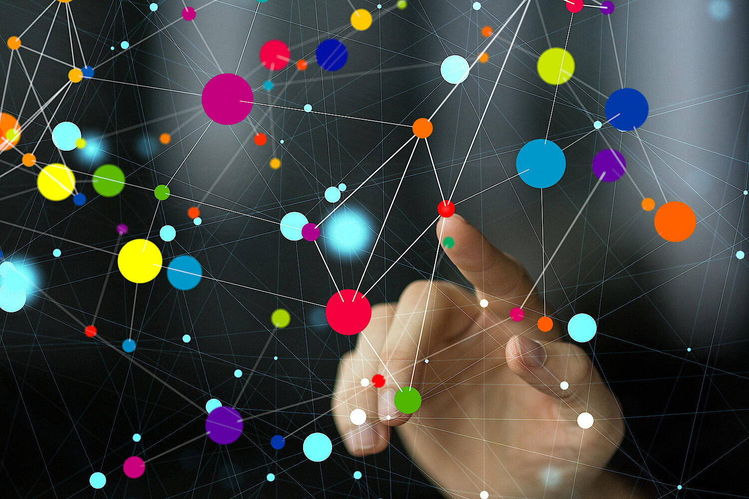 Close up of a hand pointing at a dot in a series of dots and lines