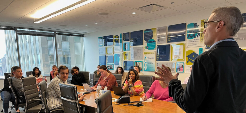 Man speaking in AAE conference room