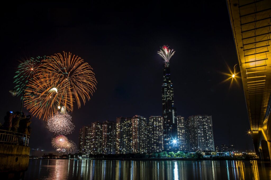Image of the New York City skyline at night as fireworks go off