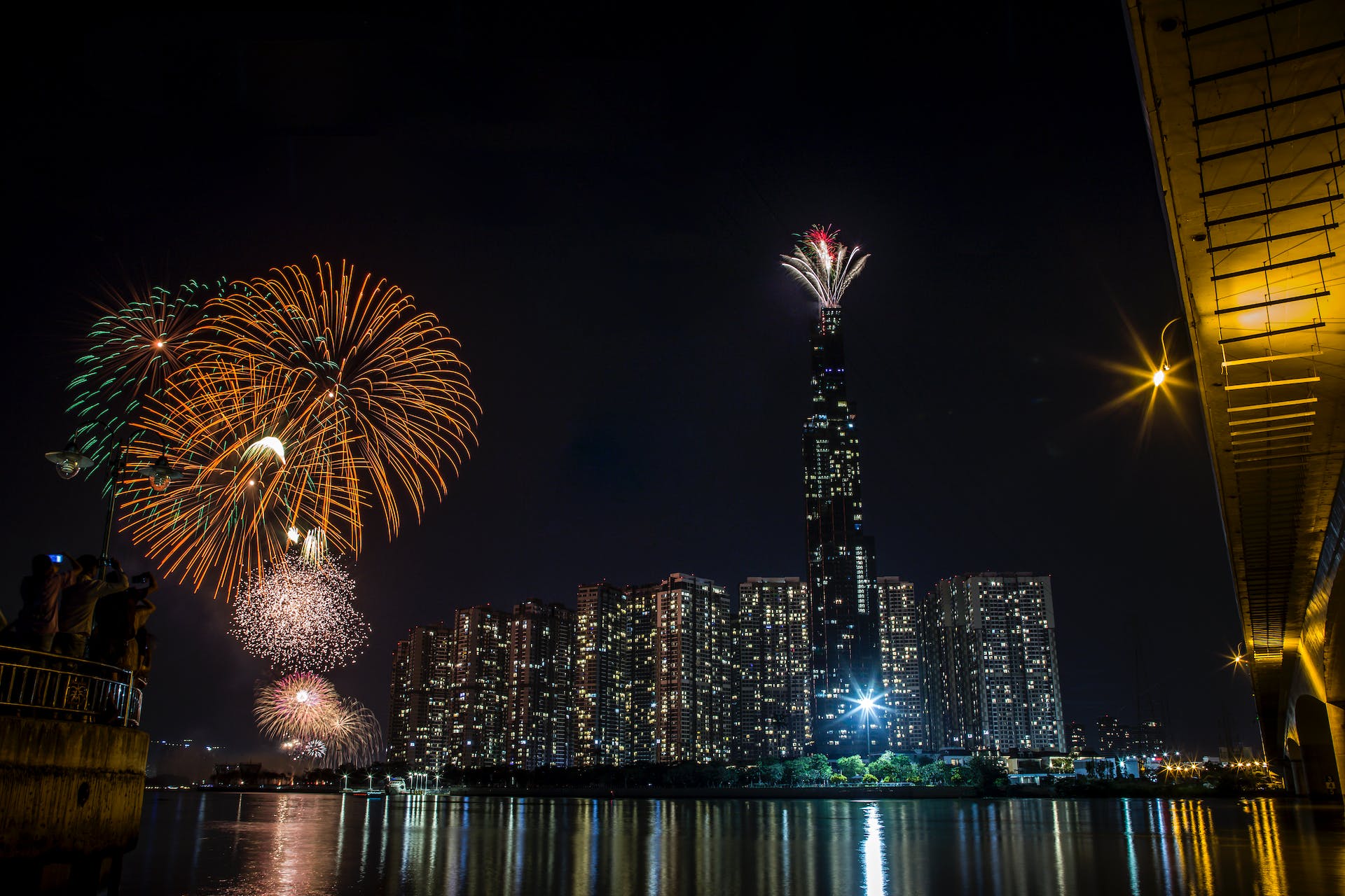 Image of the New York City skyline at night as fireworks go off