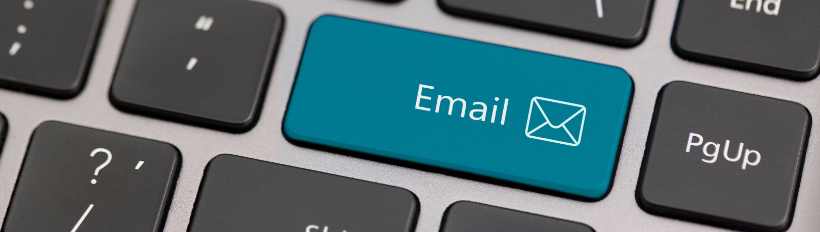 close up of the enter key on a keyboard with the text replaced to say "Email" with an envelope icon after the text