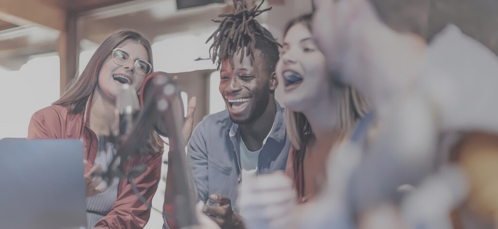 People laughing and talking in podcast mic