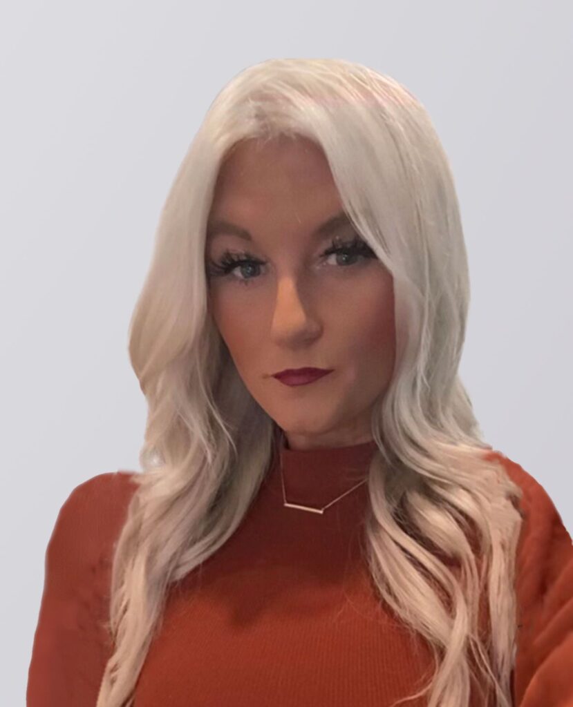 Professional of a smiling blonde women in a orange sweater