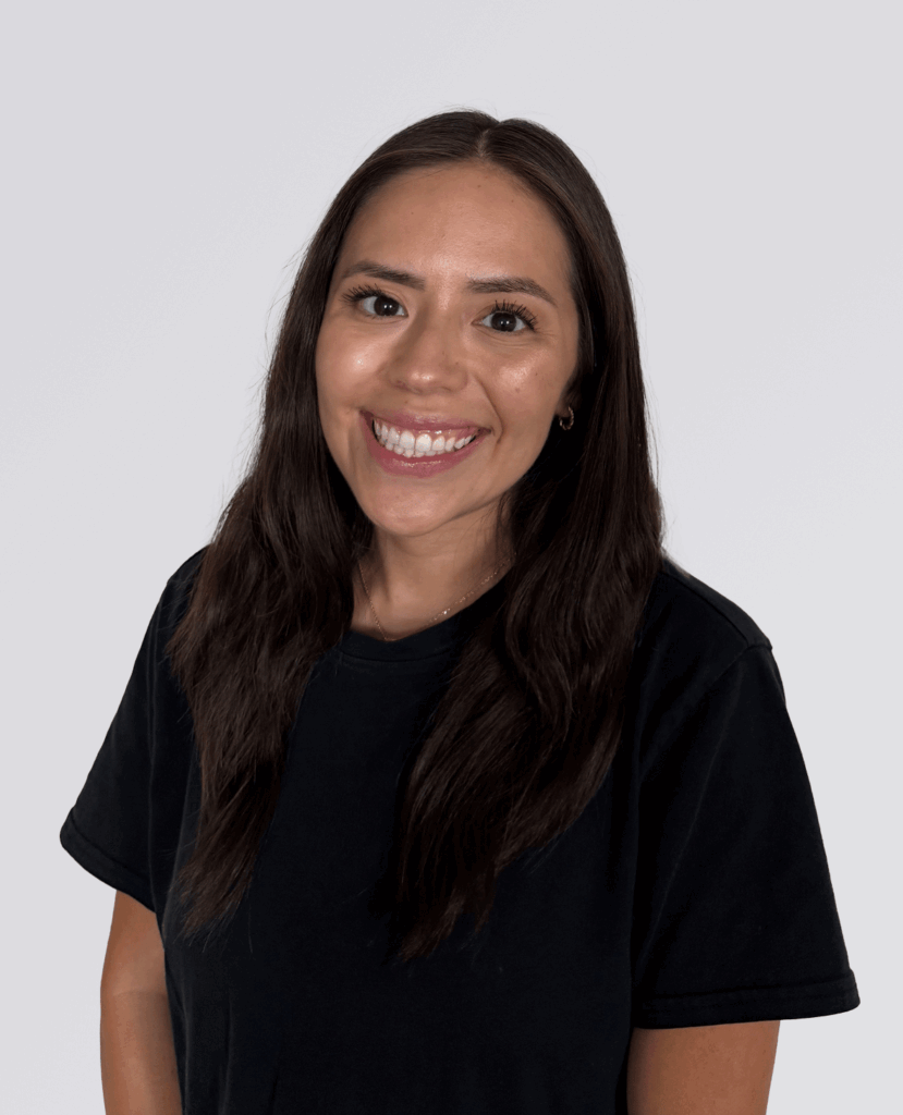 Professional headshot of a smiling women in a black shirt