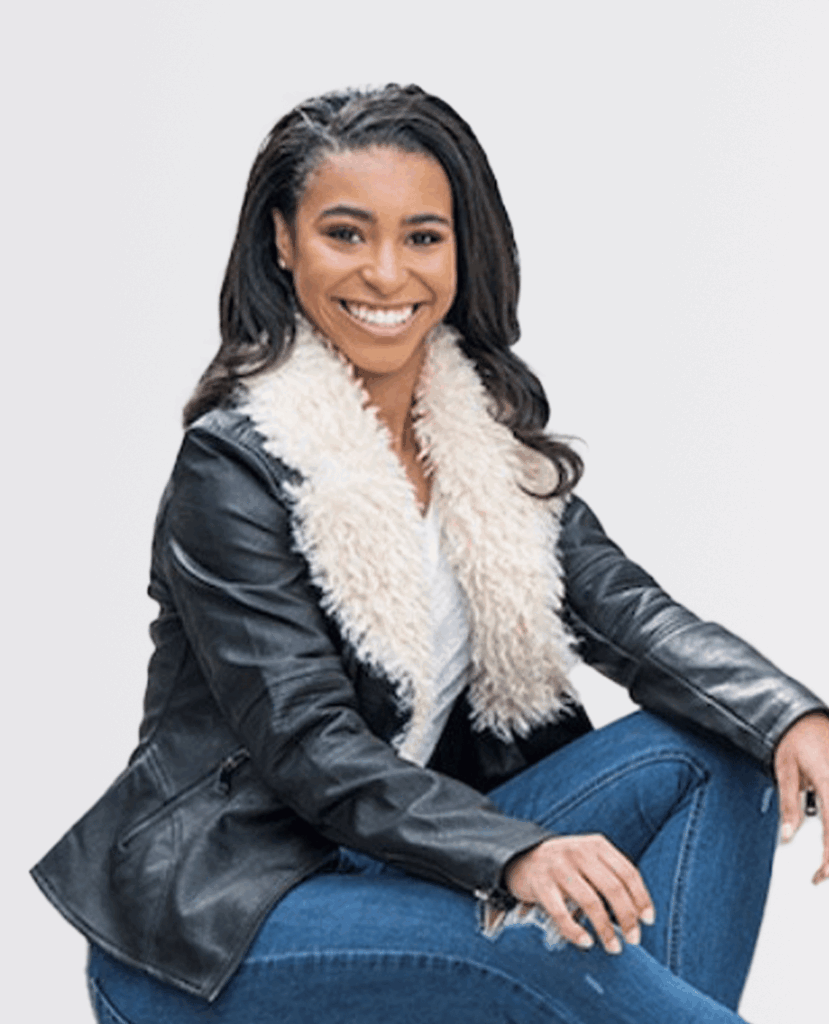 Professional headshot of a smiling woman in a black jacket