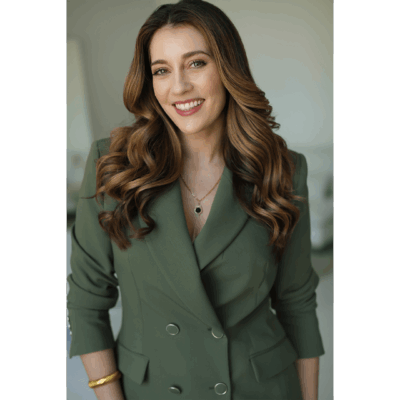 Smiling woman in a green suit jacket