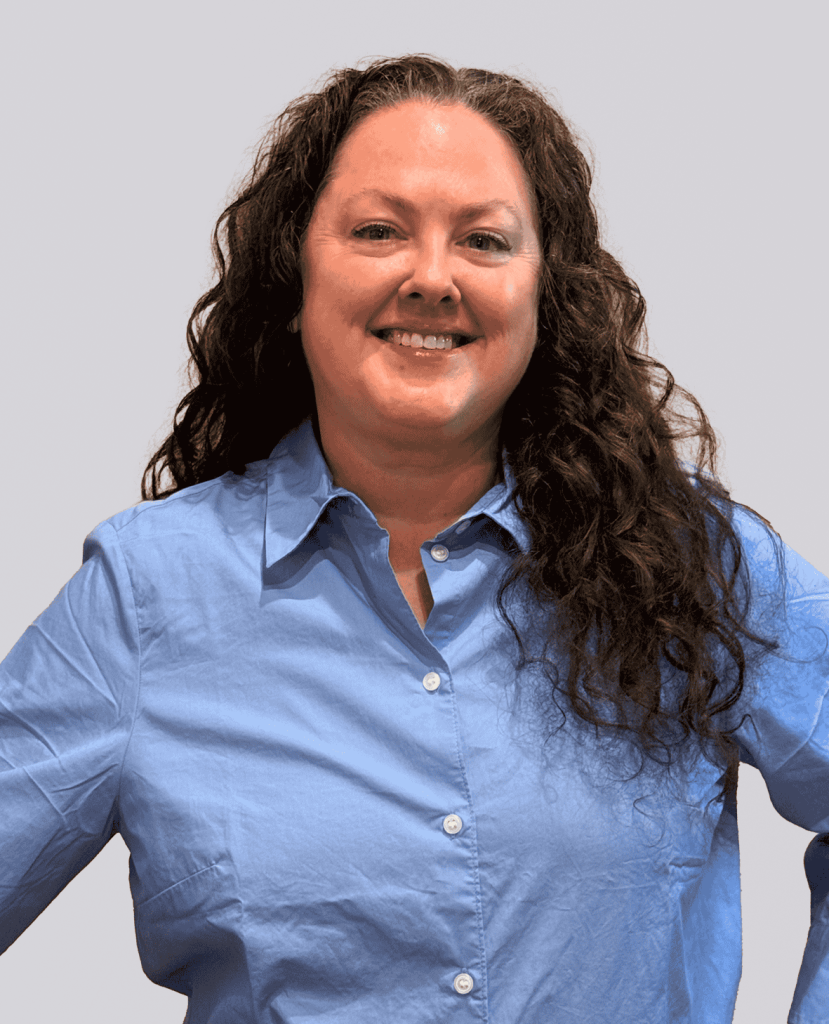 Professional headshot of a smiling woman in a blue shirt