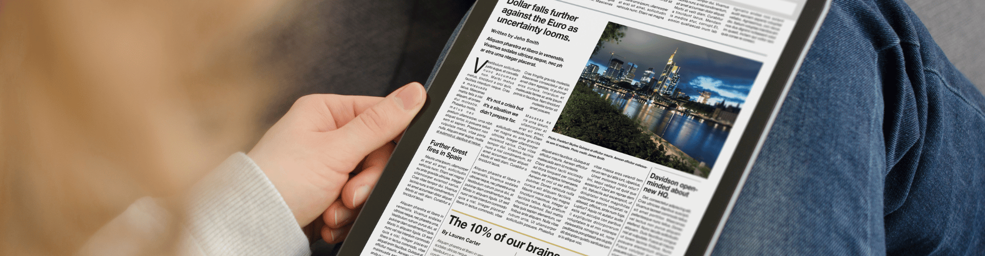Person reading news on an Ipad