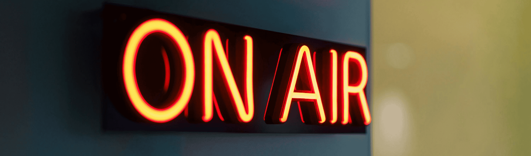 On air neon sign on wall